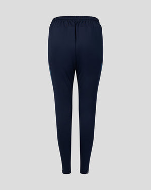 Back view of navy Harlequins training pants with elastic waistband and tapered legs