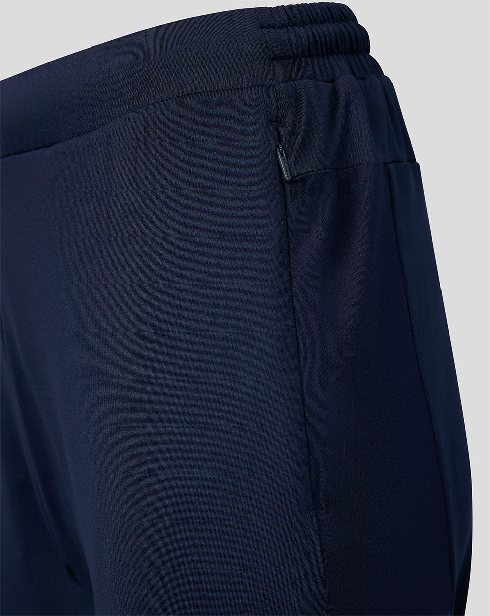 Navy Harlequins women's training pants with a zipped side pocket and elastic drawcord waistband.