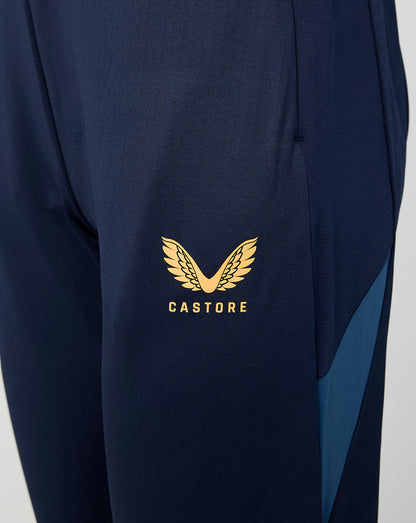 Close up of navy Leicester Tigers training pants leg with gold Castore logo.