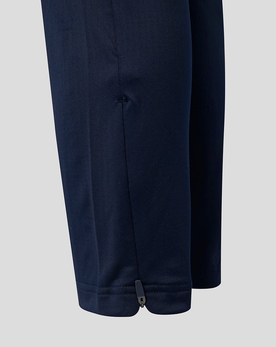 Close up of navy training pants lower leg with zip at ankle.