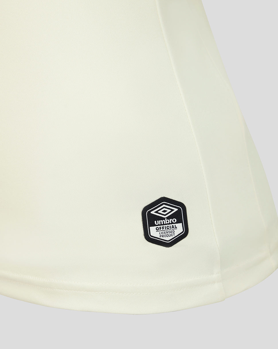 Light-colored shirt with a black Umbro logo on a white background