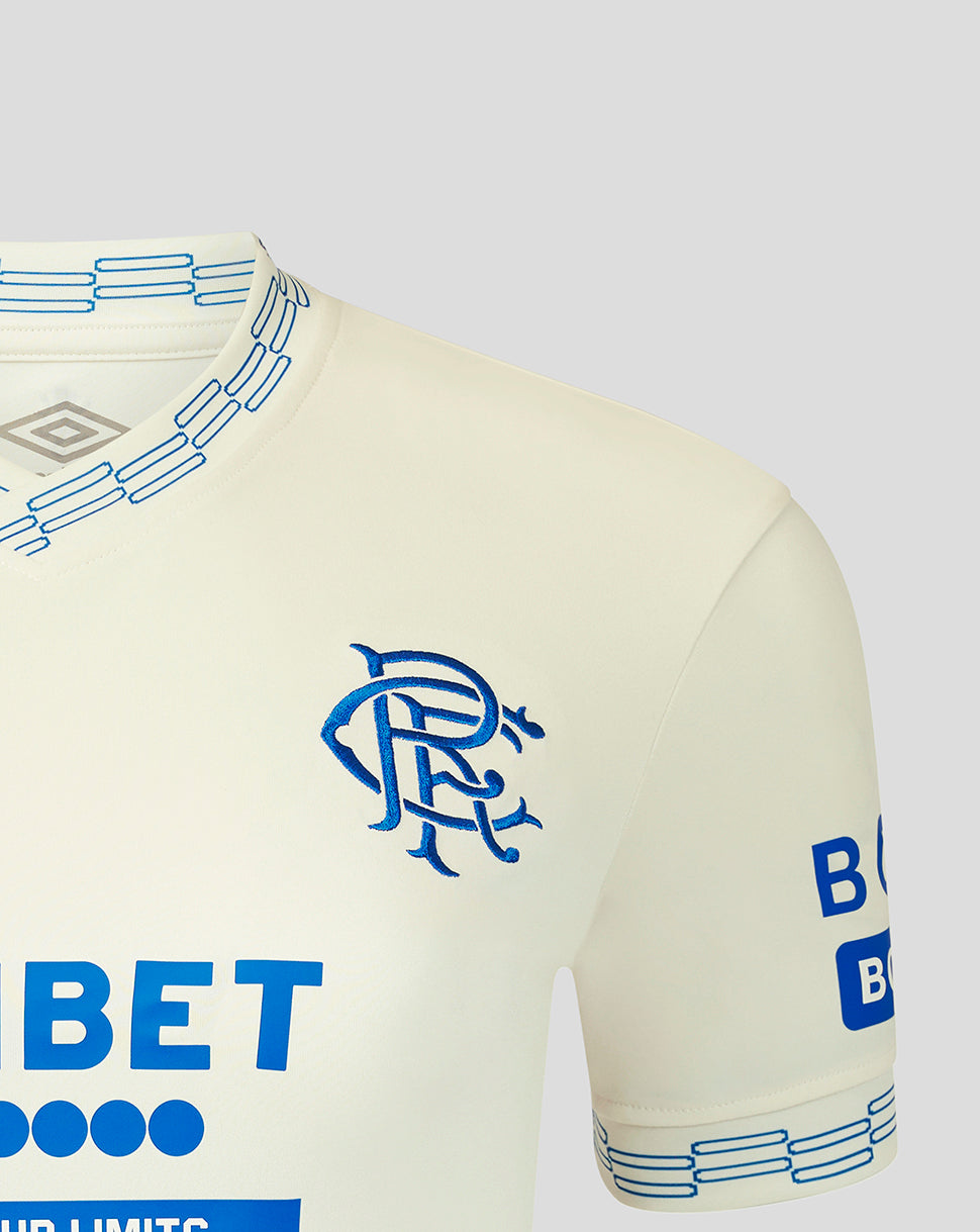 Beige sports jersey with blue branding on a light gray background