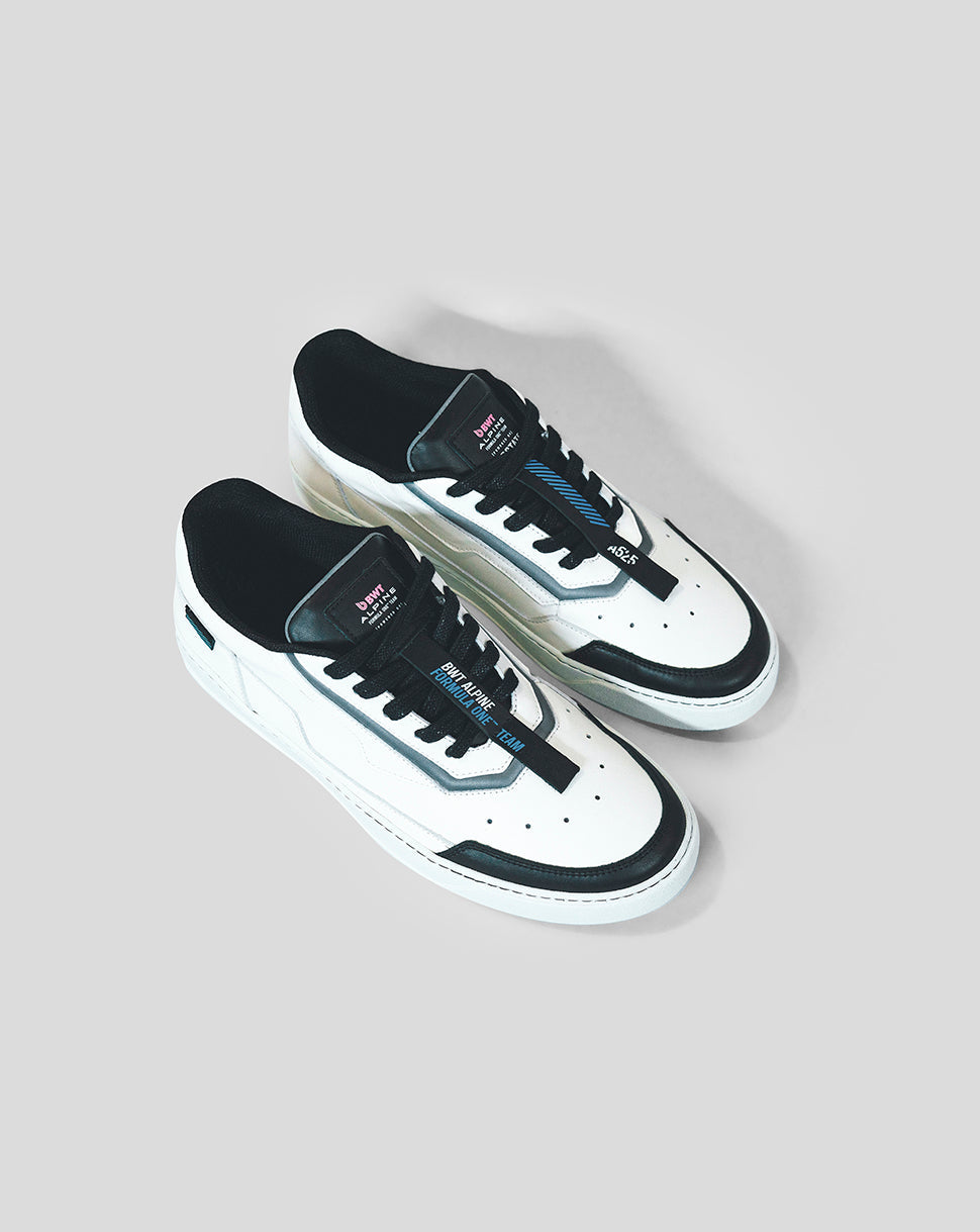 White BWT Alpine Endstate sneaker with black toe cap and blue detailing, shown from a top-down angle.
