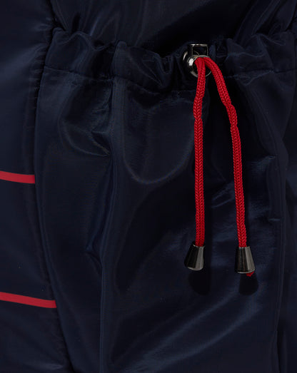 Navy blue Red Bull Racing backpack with red drawstrings and black cord tips.