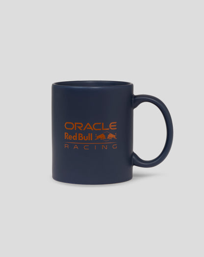 Dark blue mug with orange Oracle Red Bull Racing logo and a left side handle.