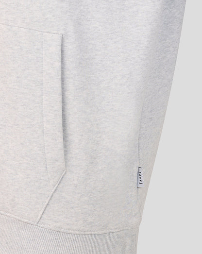 Close-up of the grey hoodie pocket with a small AOF tag along the side seam.