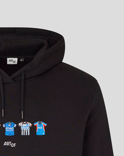 Close up of black hoodie showing the hood and a row of small football jerseys across the chest with the ART OF label at the neckline