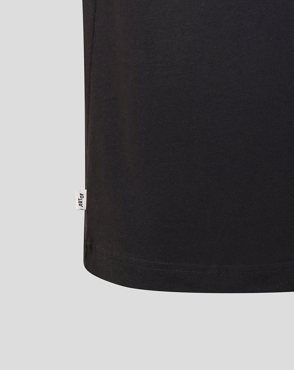 Hem of black T shirt with small ArtOf label at the side seam
