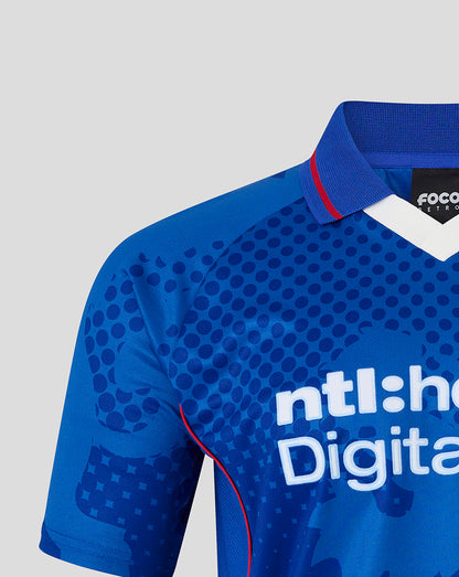 Shoulder and chest of the blue Rangers jersey with dotted print and large abstract shapes and a blue collar.