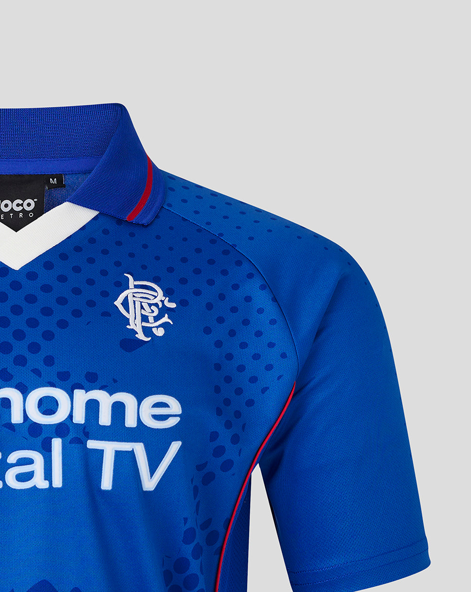 Chest area of blue Rangers retro home shirt showing white club crest and bold sponsor text beneath a white V-neck collar.