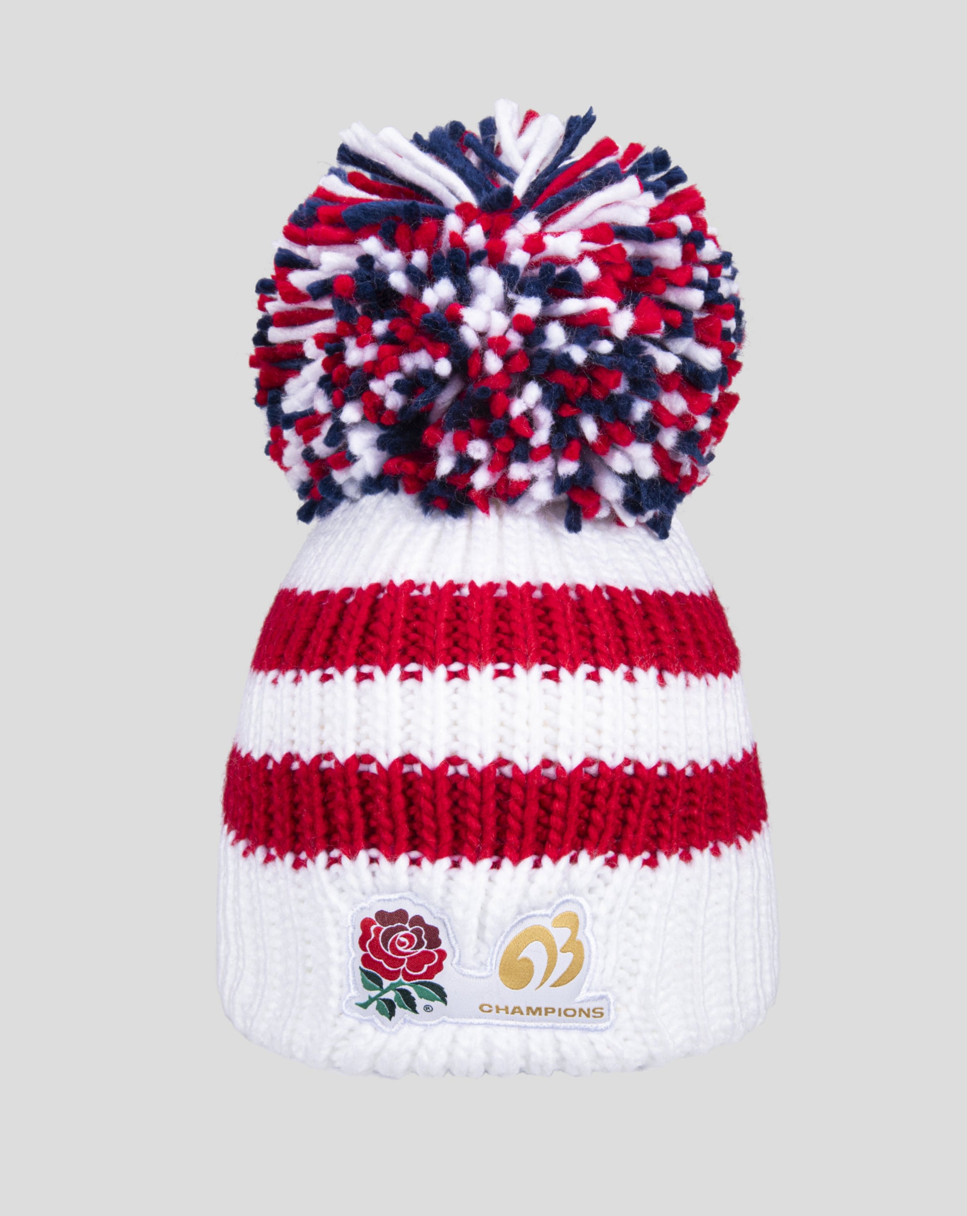 Red white and blue pom pom on top of a white knit bobble hat from the Champions 2003 collection.