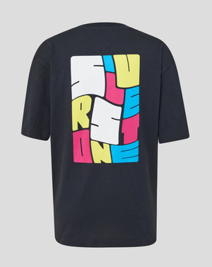 A black short-sleeve t-shirt shown from the back, featuring a large, colorful graphic print on the back. The graphic is composed of stylized block letters in yellow, pink, and blue, with white rectangular shapes, all outlined in black.