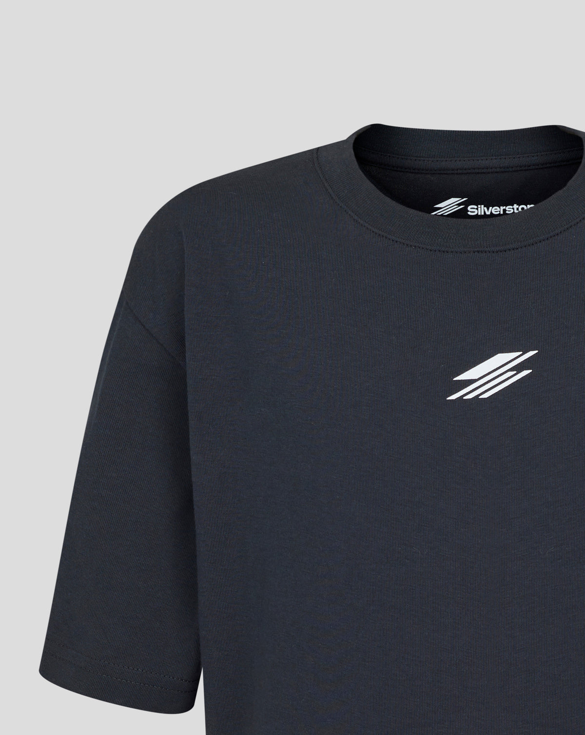 Black t-shirt with a logo on a gray background