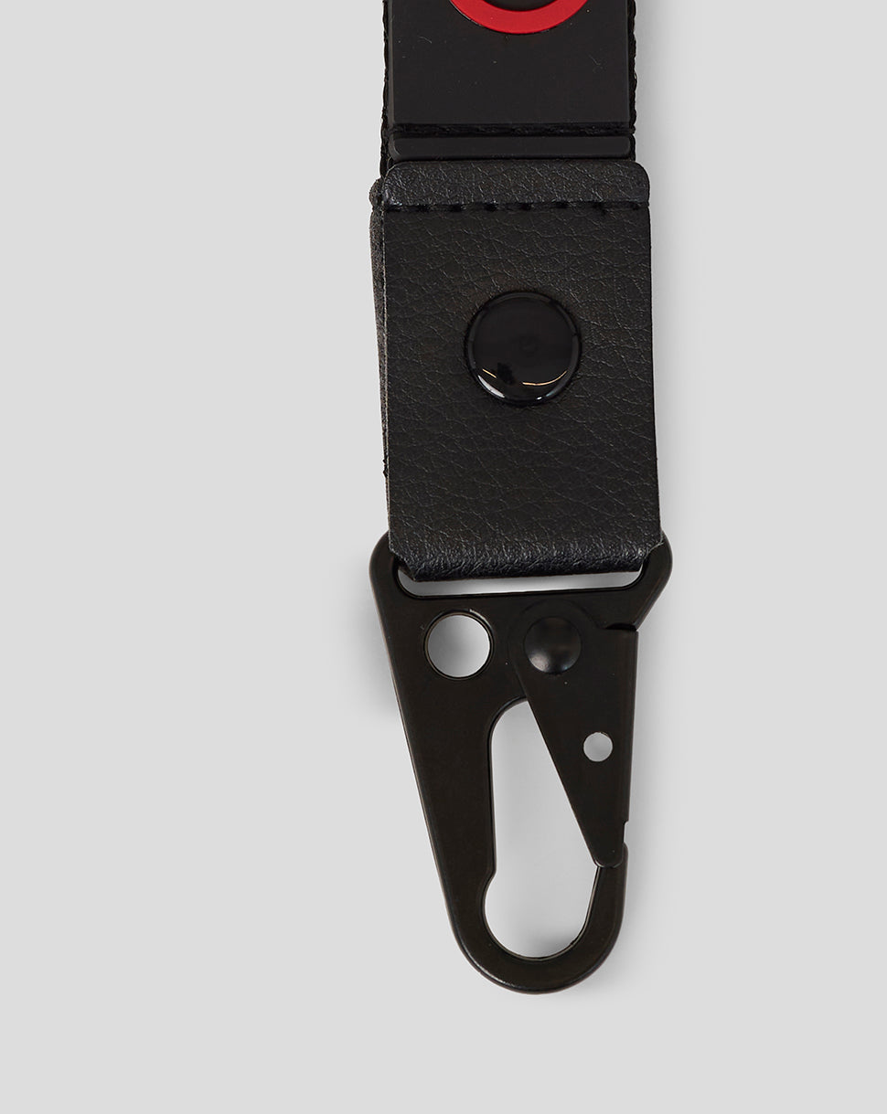 Official Haas Team Lanyard close up in black with red branding and a clip attachment