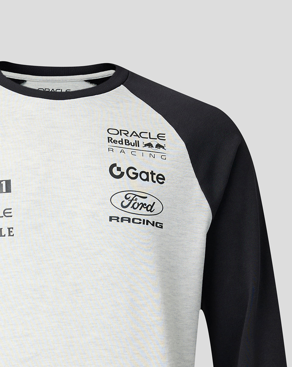 Gray and black long-sleeve shirt with various brand logos on a light gray background