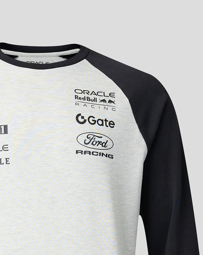 Gray and black long-sleeve shirt with various brand logos on a light gray background