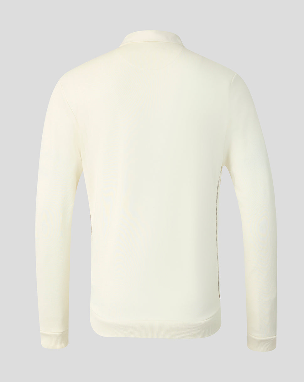 A long-sleeve knit top shown from the back, in a solid cream or off-white color, displayed on a neutral light gray background.