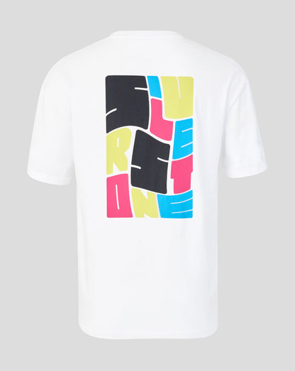 A white short-sleeve t-shirt shown from the back, featuring a large graphic print of the word 'SILVERSTONE' in a bold, colorful block pattern of black, yellow, pink, and blue.