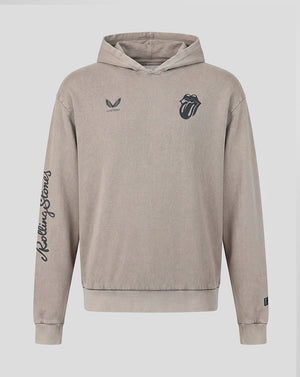 A beige hooded sweatshirt featuring the Rolling Stones tongue and lips logo on the left chest, a small wing logo with 'Castore' on the right chest, and 'Rolling Stones' written vertically in script down the right sleeve, shown against a light gray background.