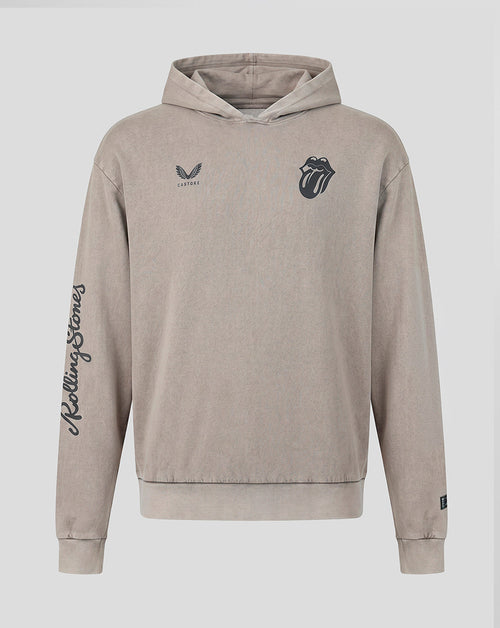A beige hooded sweatshirt featuring the Rolling Stones tongue and lips logo on the left chest, a small wing logo with 'Castore' on the right chest, and 'Rolling Stones' written vertically in script down the right sleeve, shown against a light gray background.