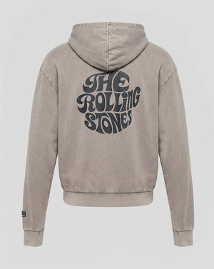 A beige hooded sweatshirt shown from the back, featuring a large black 'The Rolling Stones' logo printed across the center. The hoodie has a washed, textured finish and is displayed on a neutral light gray background.