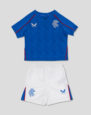 Rangers Baby 24/25 home kit laid flat blue shirt with white shorts featuring club crest and Castore branding