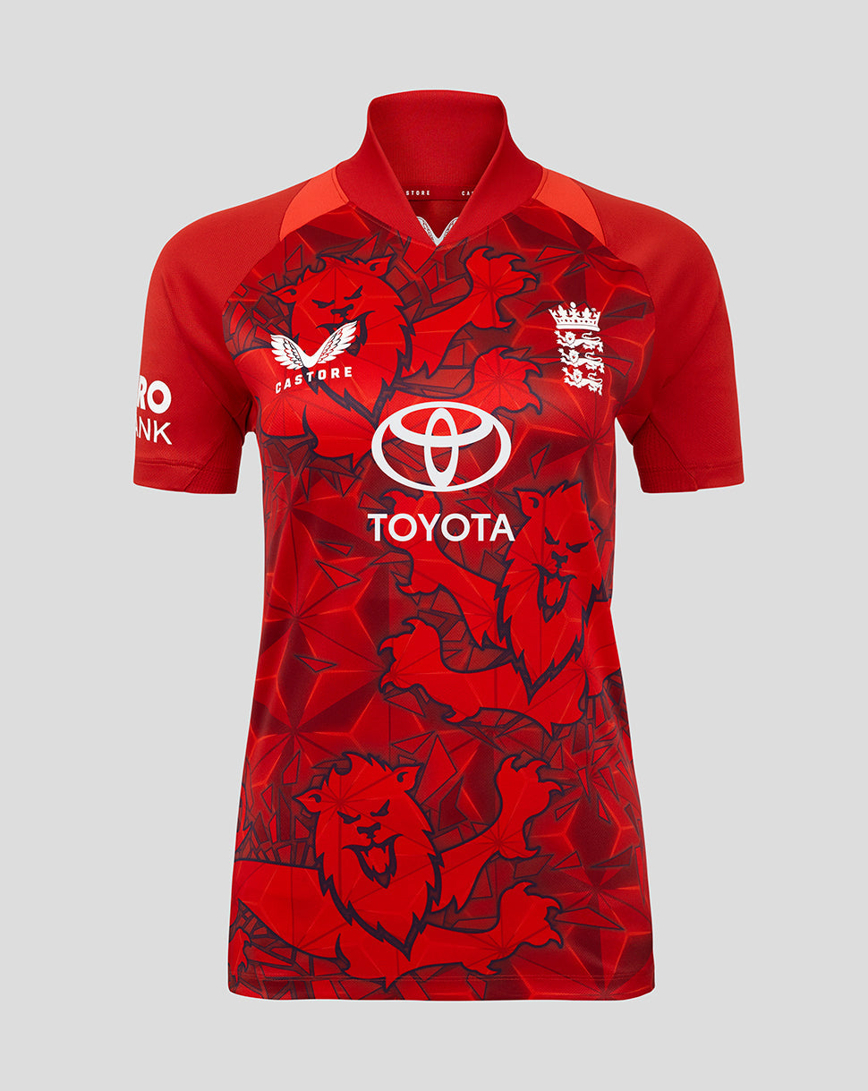 Red women's England 25/26 T20 shirt with bold lion graphics and matching cap.