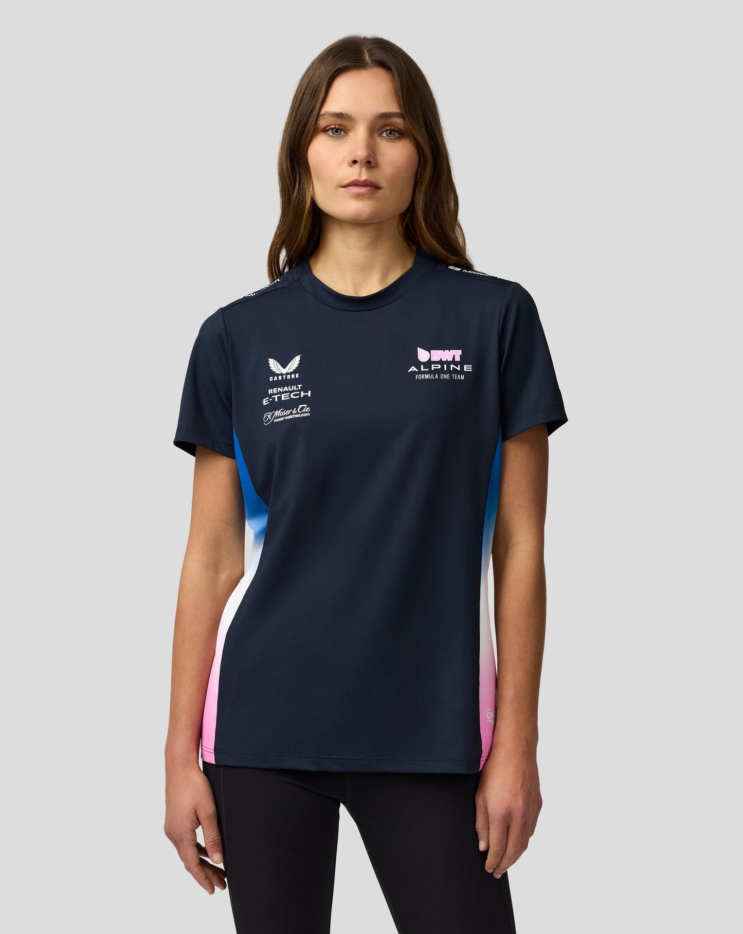 Woman wearing navy BWT Alpine Formula One Team Set Up T Shirt with sponsor logos on the front
