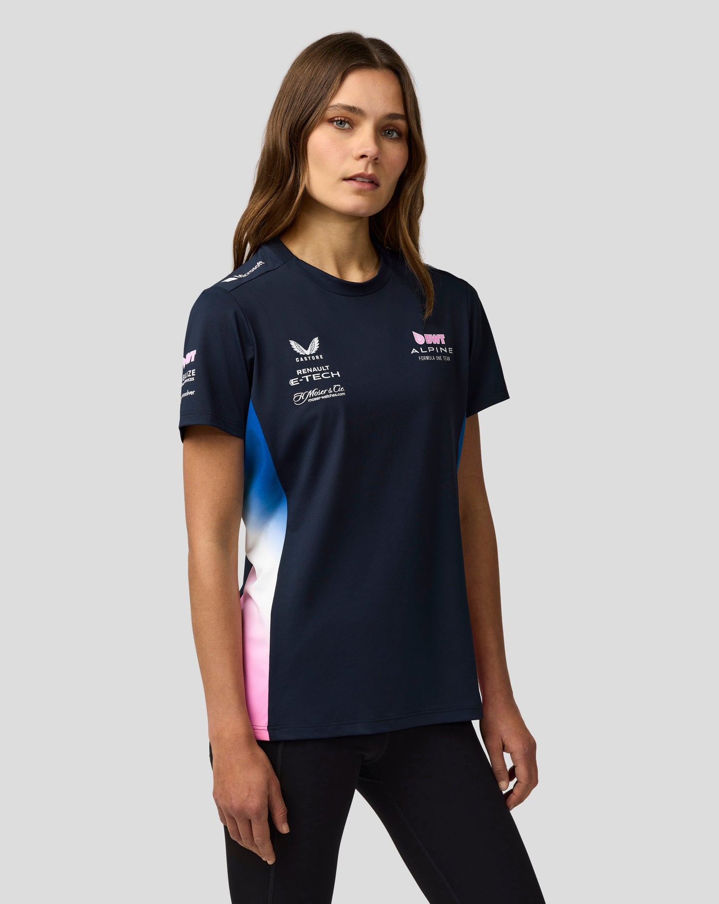 Female model wearing navy BWT Alpine Formula One Team Women's Official Set Up T Shirt with sponsor logos on the front.