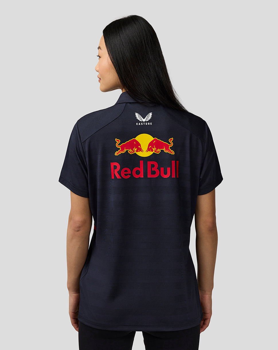 Back view of a navy Red Bull Racing polo showing a large Red Bull logo and Verstappen artwork.