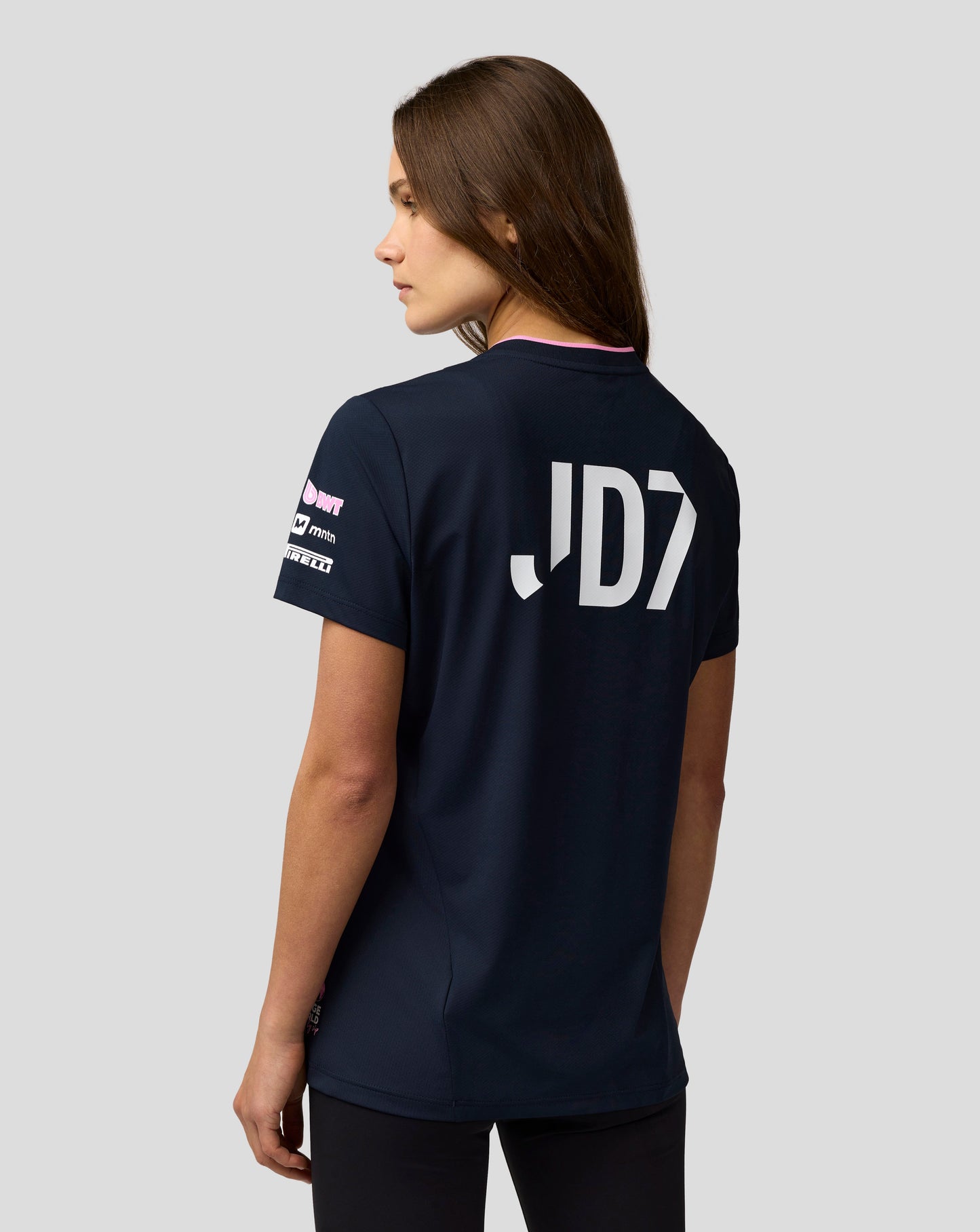 Back view of navy Alpine F1 Team Jack Doohan jersey showing large white JD7 on the back and pink neck trim
