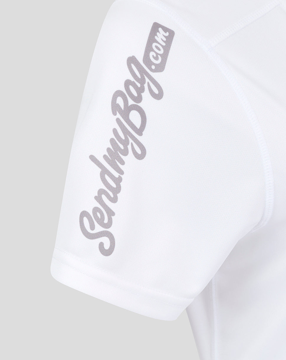 Close-up of the sleeve on a white Ulster shirt showing a large scripted sponsor logo.