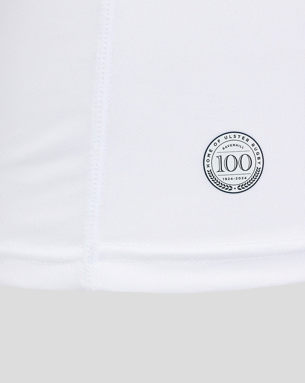 Close-up of the lower side of the shirt displaying a circular 100th anniversary badge.