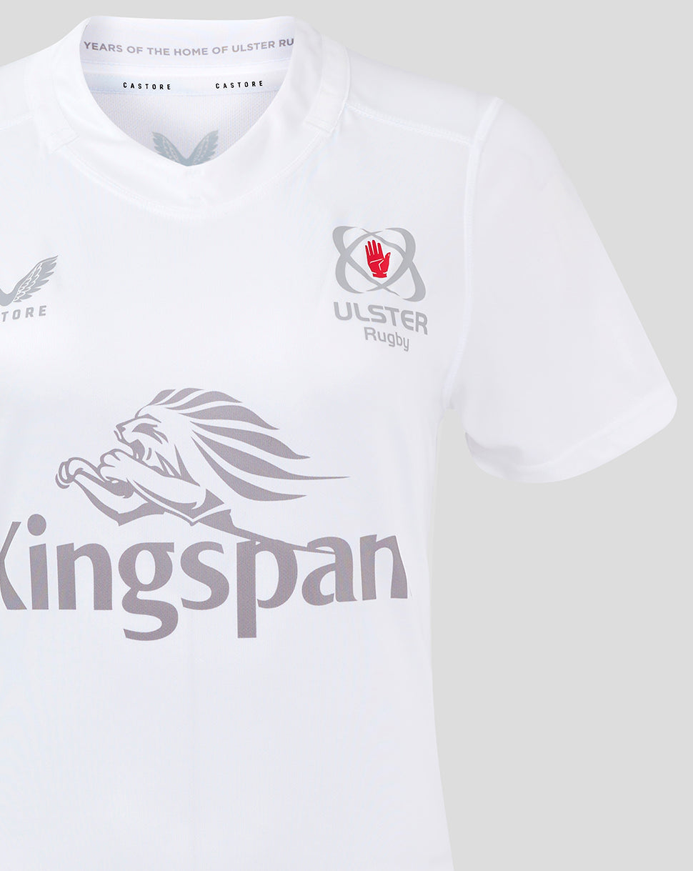 Detail of white Ulster women's rugby shirt with Ulster crest on the chest and large Kingspan logo across the front