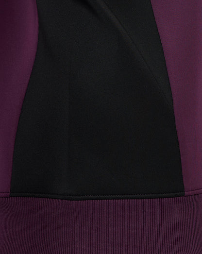Close-up of contrast side panel on burgundy England cricket training sweatshirt showing a black panel.