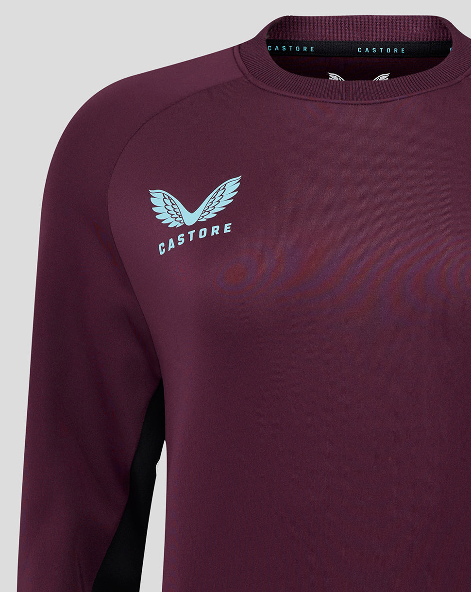 Close-up of burgundy England cricket training sweatshirt chest featuring a light blue Castore logo.