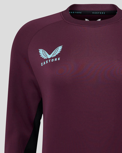 Close-up of burgundy England cricket training sweatshirt chest featuring a light blue Castore logo.