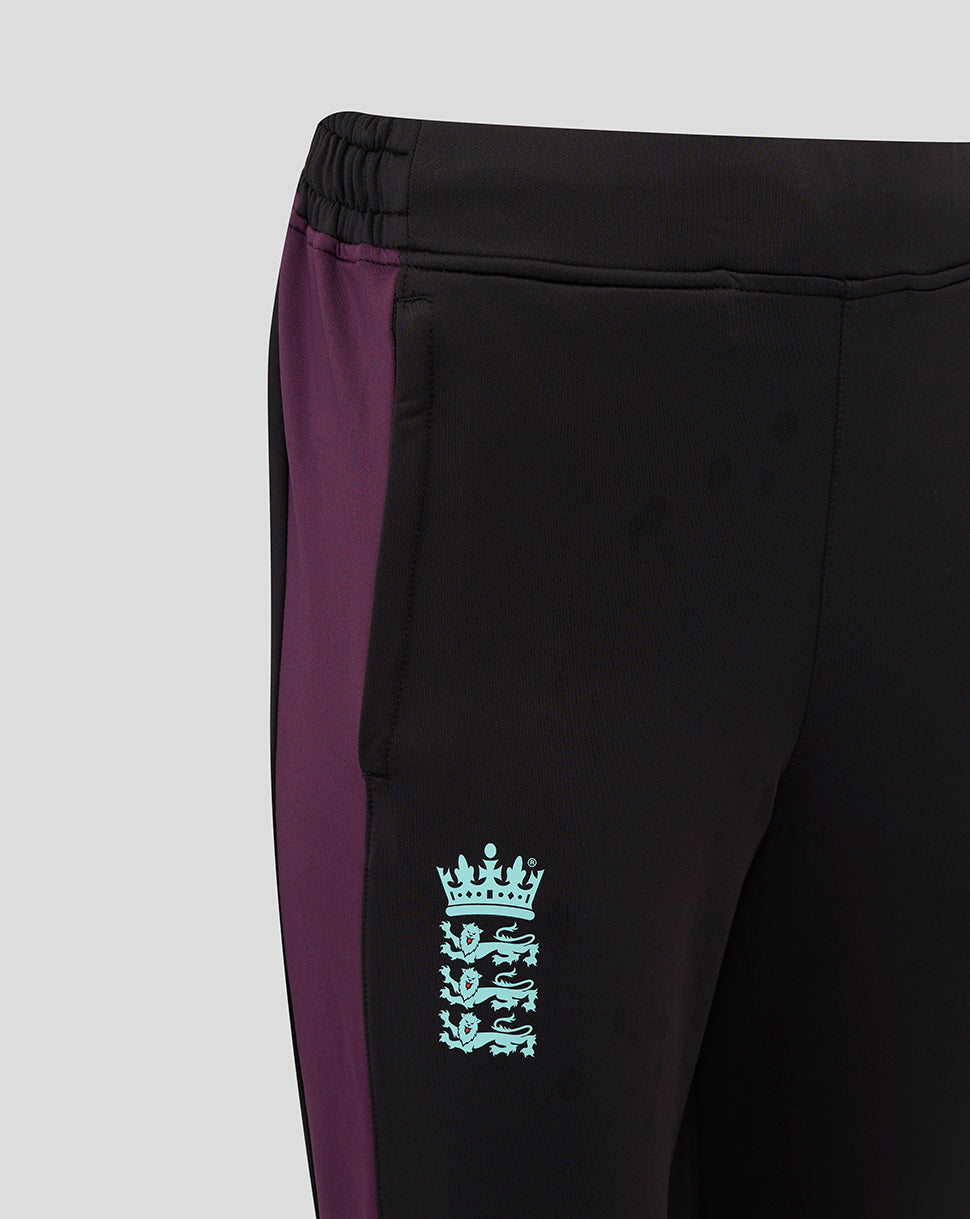 Side view of black women's England cricket training pants with a purple side panel and a light blue crest on the thigh.