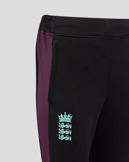 Side view of black women's England cricket training pants with a purple side panel and a light blue crest on the thigh.