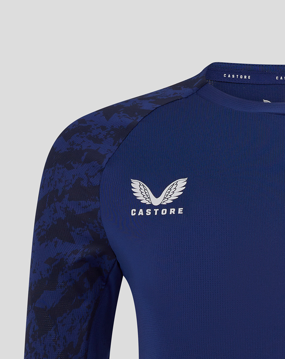 Close up of Preston North End blue training T shirt with Castore logo and club crest and camo sleeve detail