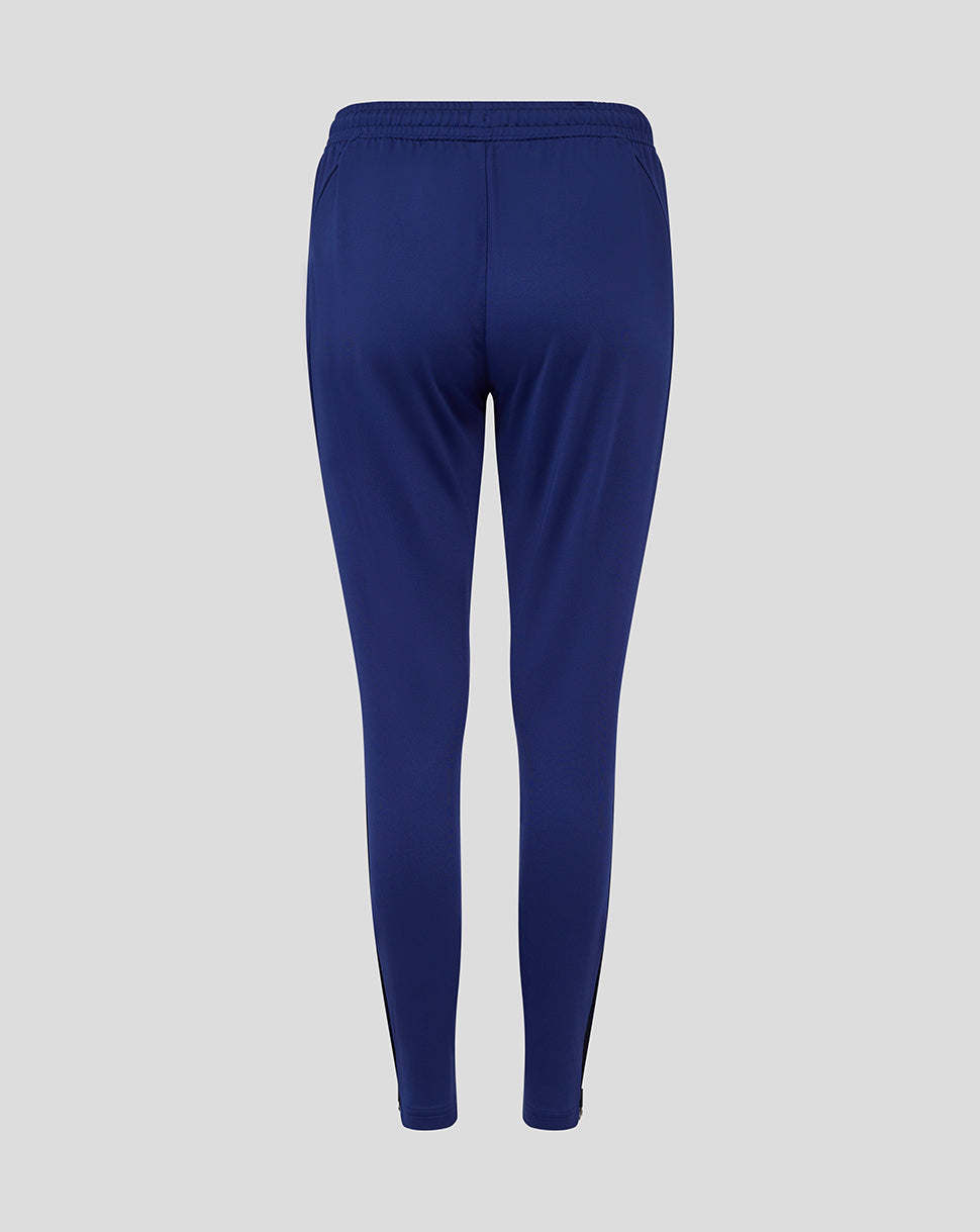 Back view of blue Preston Women's training knit pants with elastic waistband.