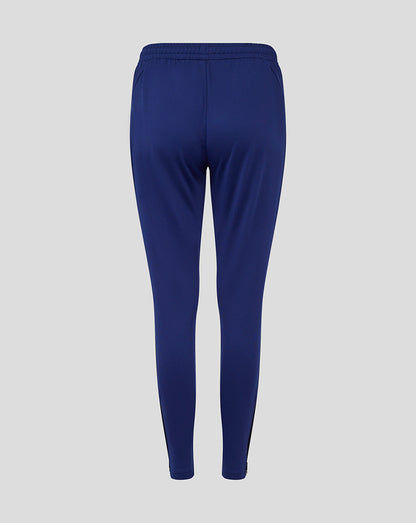 Back view of blue Preston Women's training knit pants with elastic waistband.