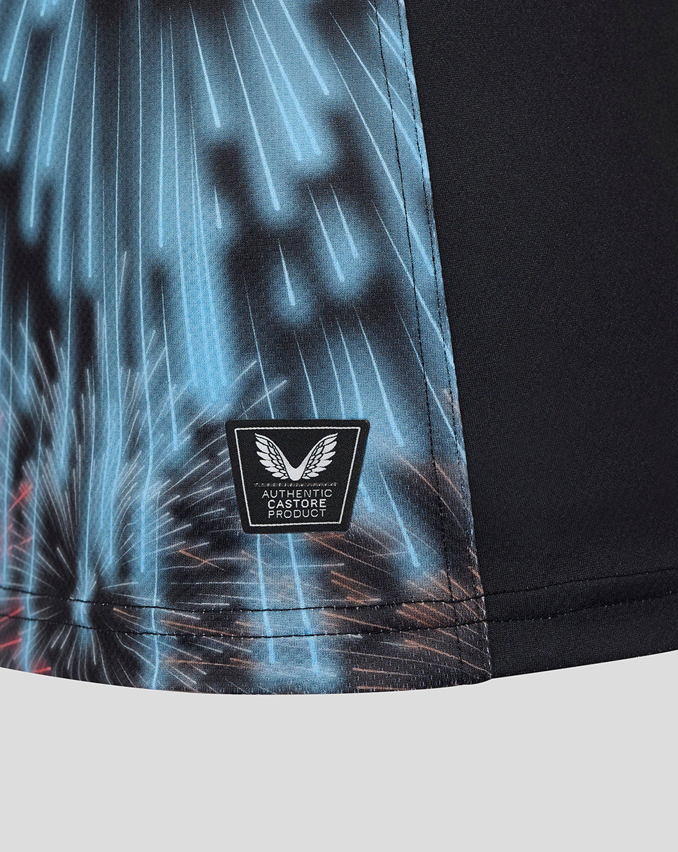 Hem area of the shirt showing blue fireworks print and an Authentic Castore Product badge.