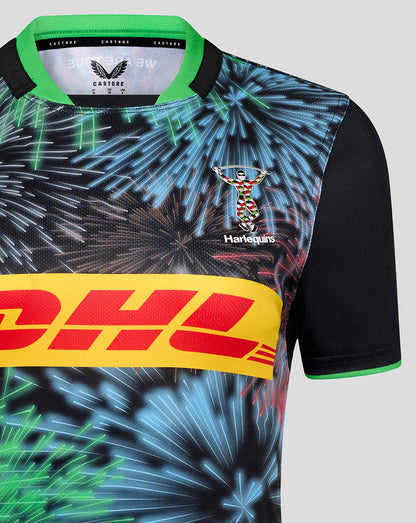 Close up of Harlequins Big Game replica shirt with a vibrant fireworks print, bold yellow DHL sponsor band, and club crest.