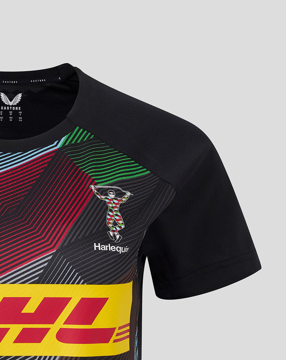 Chest area of Harlequins matchday tee featuring colorful diagonal graphic, Harlequins emblem, and DHL sponsor panel on black fabric