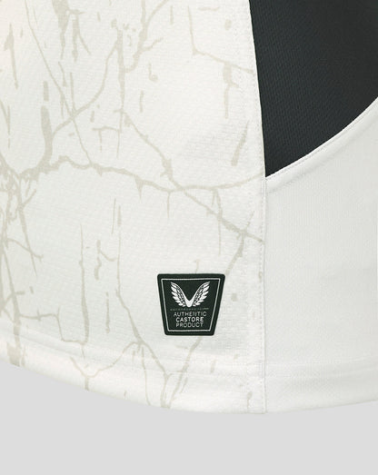 Close-up of the Saracens away shirt fabric with authentic Castore product badge near the hem.
