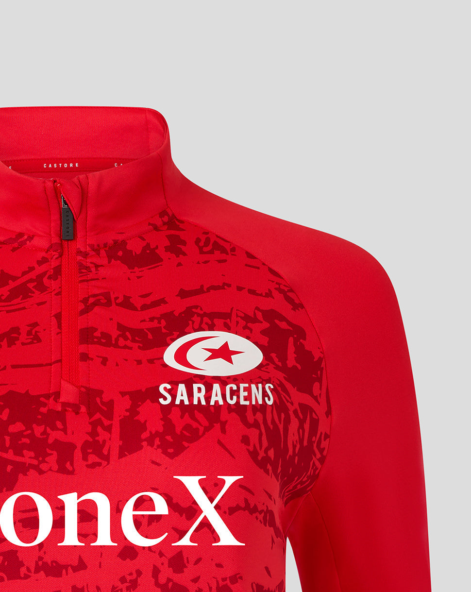 Red Saracens pre match midlayer top with white Saracens logo and bold abstract print inspired by Take Flight