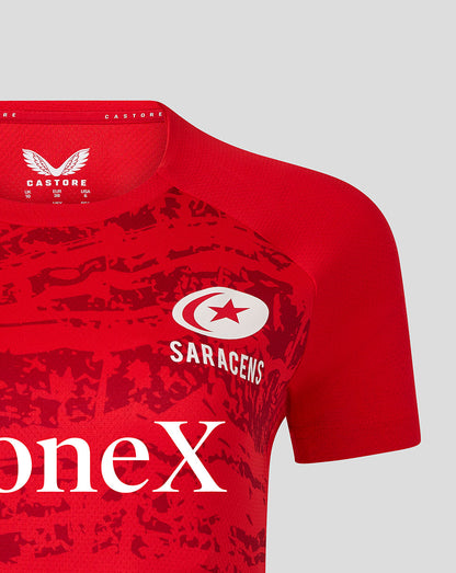 Red Saracens short sleeve top with white crest and Saracens logo on the chest and large StoneX sponsor text across the front.