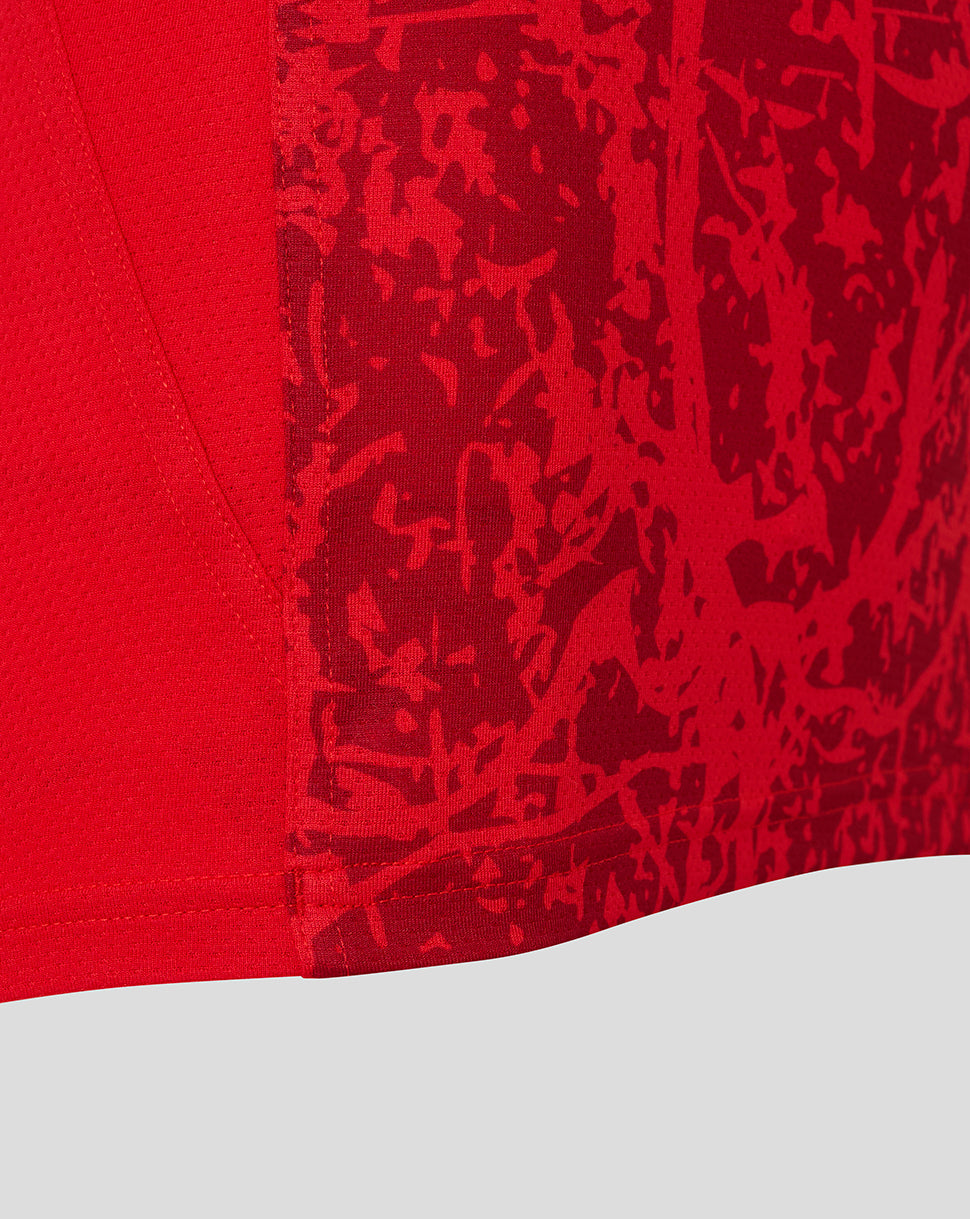 Close-up of red textured fabric with a pattern on the Saracens women's 25/26 matchday sleeveless tee