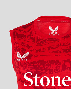 Close up of the red sleeveless tee neckline showing Castore branding and size label inside